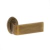 Atlantic Handles Monza Forme Designer Lever on Contempo Round Rose in a Yester Bronze Finish Pair of Door Handles